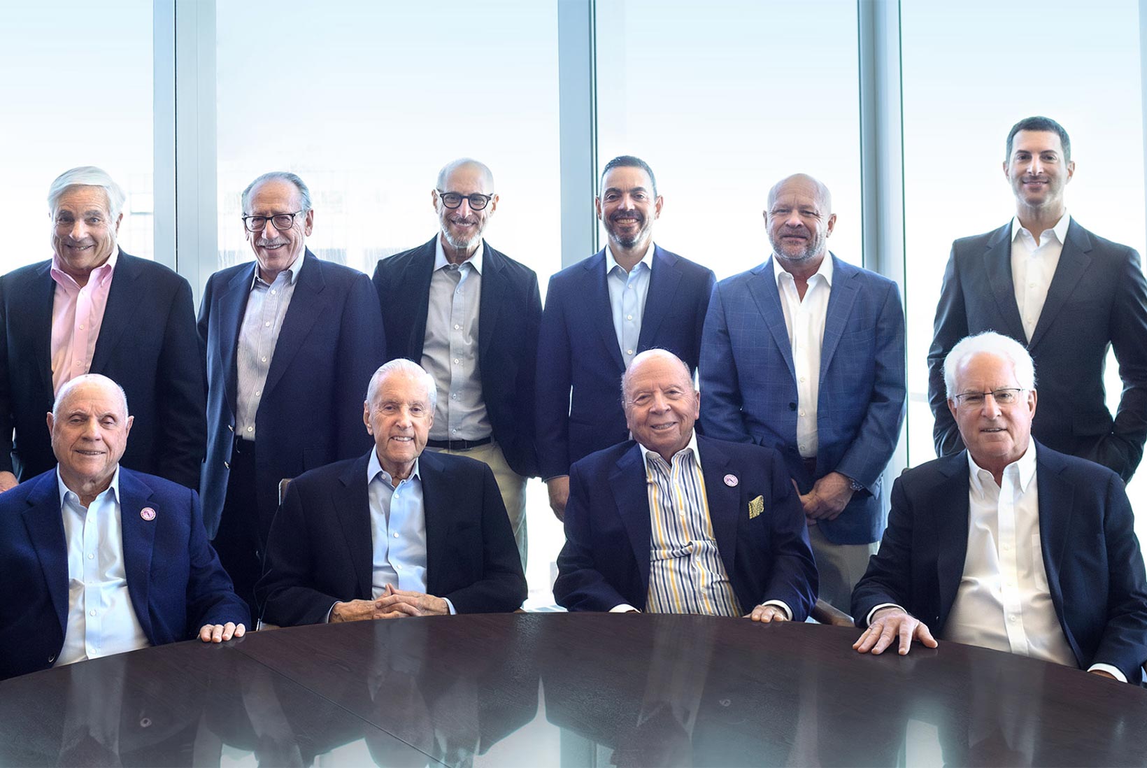 Group portrait of the extended Wilpon and Katz ownership team